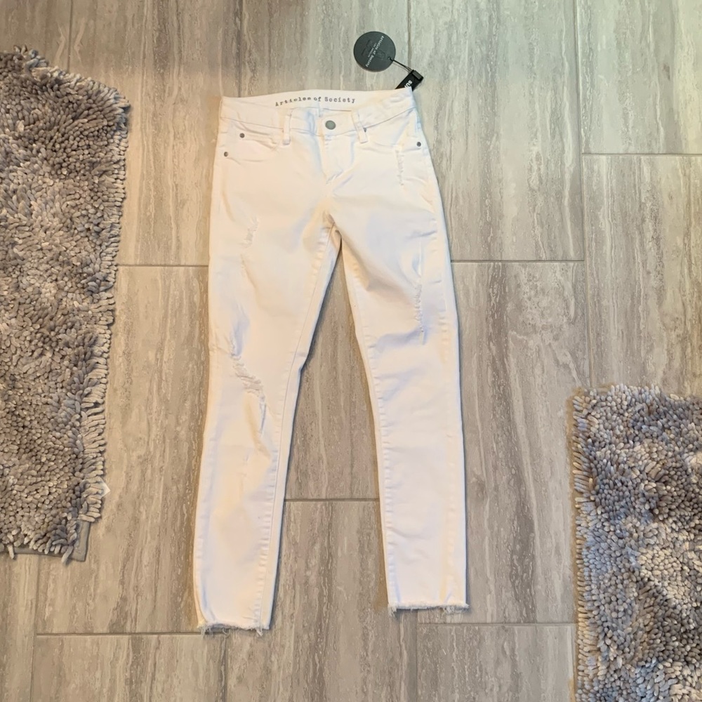 White cropped distressed skinny jeans